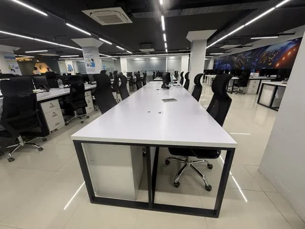 Open-plan IT office interior with modern furniture setup