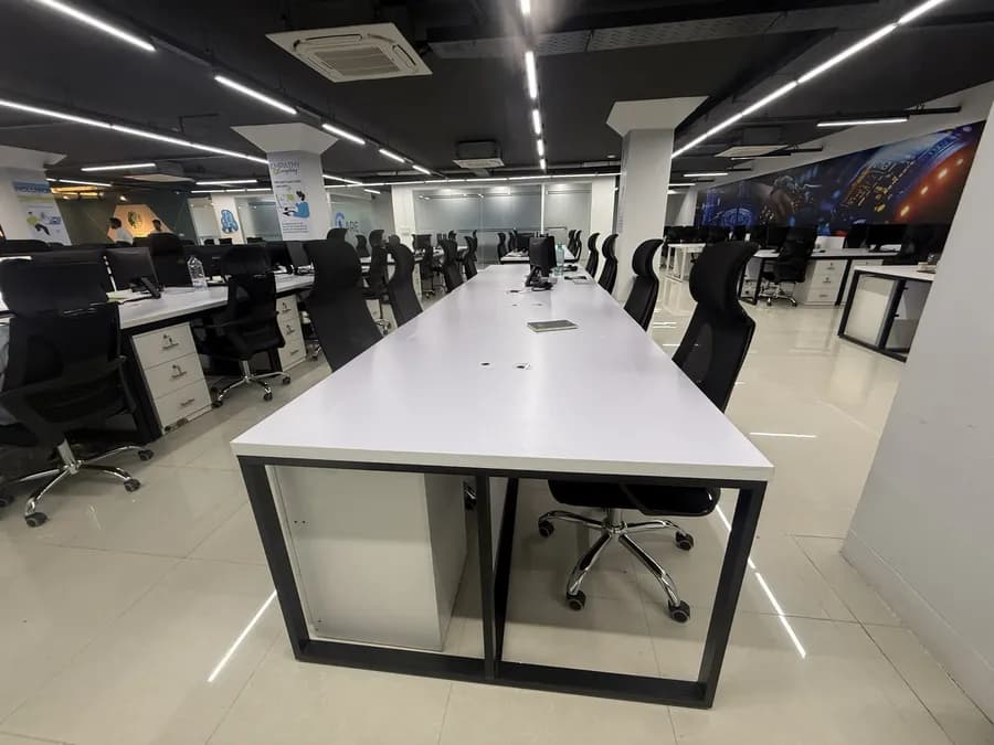 Open-plan IT office interior with modern furniture setup