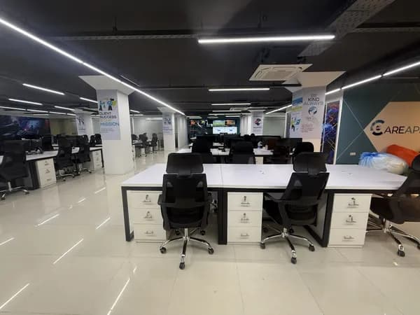 Open layout corporate workspace with warm lighting