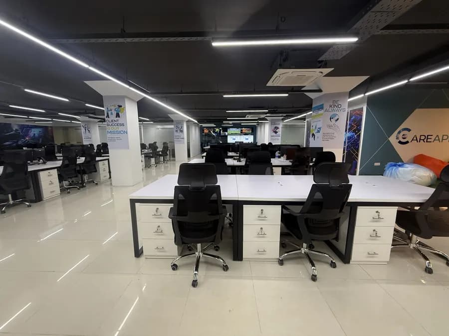 Open layout corporate workspace with warm lighting