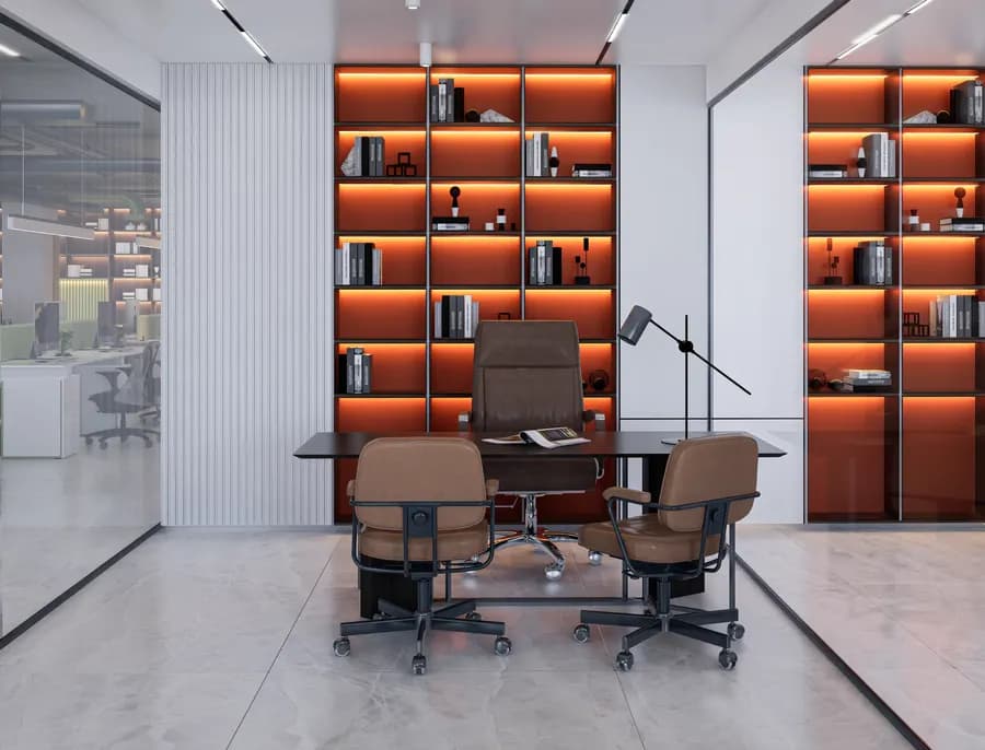 Dedicated quiet focus area with bookshelf and comfortable seating in corporate office